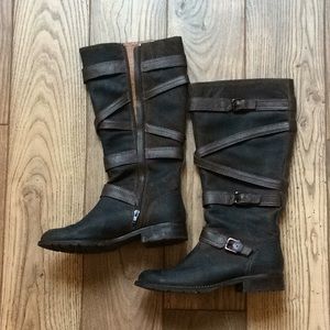 Tall strappy leather boots